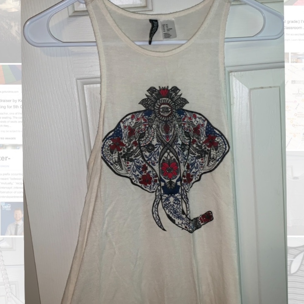 Cute tank top with elephant print on front!